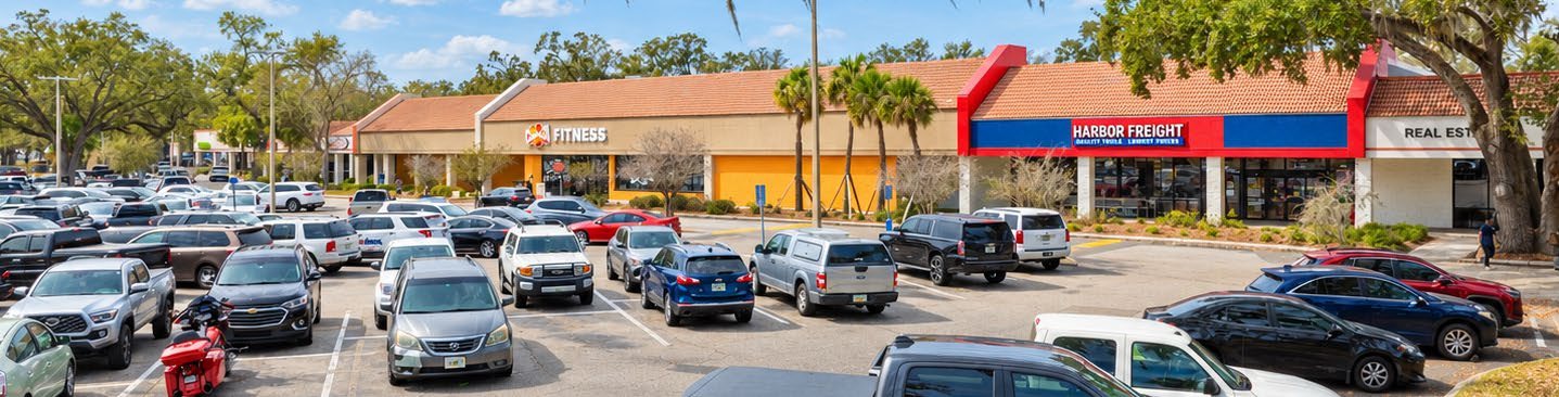 Royal Oaks parking field and storefronts